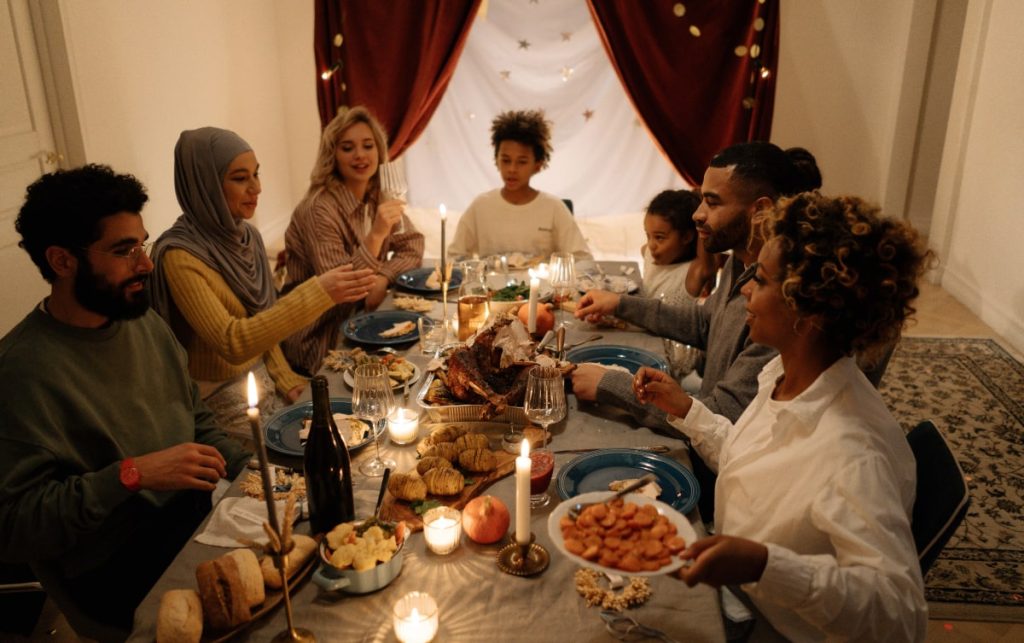 Thanksgiving feast being celebrated by enjoying traditional food