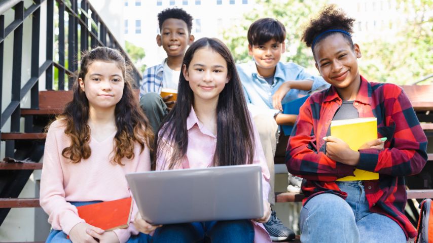 law students of different races with-laptops