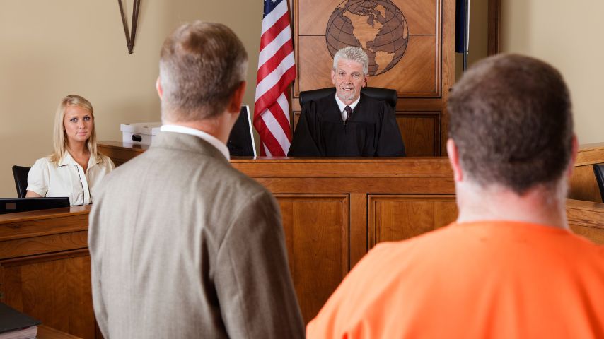 Criminal and lawyer in a courtroom